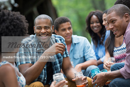 A group of men and women outdoors enjoying themselves.