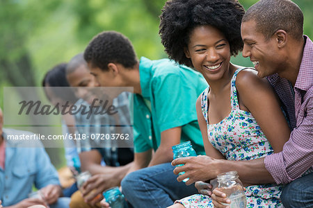 A group of men and women outdoors enjoying themselves.