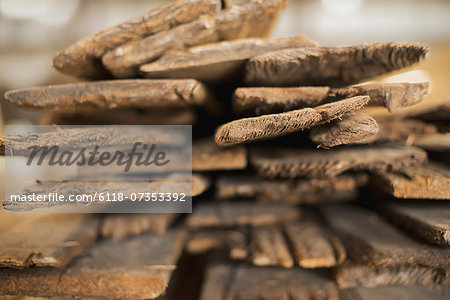 A heap of recycled reclaimed timber planks of wood. Environmentally responsible reclamation in a timber yard.