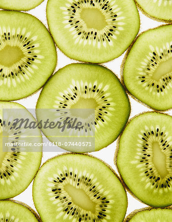 Organic kiwi slices, white background Organic kiwi slices, white background
