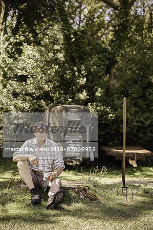 Man sitting in a garden.