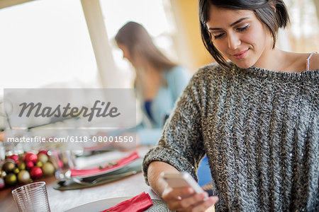 A woman checking her smart phone.