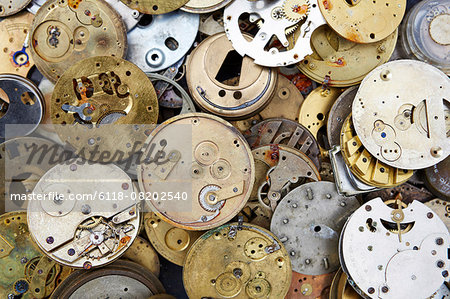 Close up of a selection of vintage clockworks at a flea market.