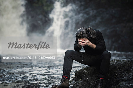 Premium Photo  Thermos with a hot drink on mountain waterfall