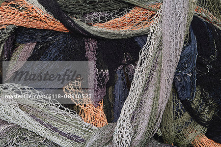 Close up of a pile of tangled up commercial fishing nets. - Stock Photo -  Masterfile - Premium Royalty-Free, Code: 6118-08910523