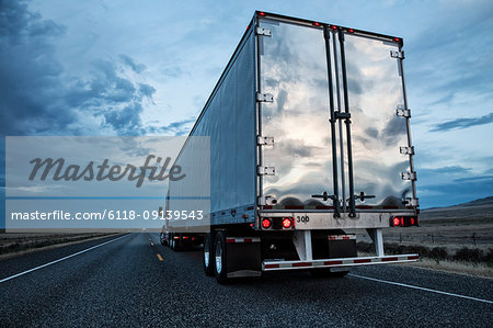 Rear view of the trailer on a Class 8 commercial truck on the highway.