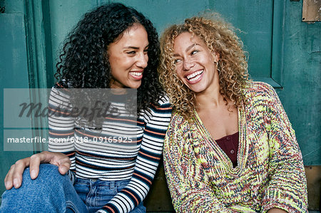 Free Photo  Portrait of two young beautiful smiling girls in