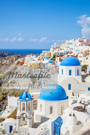 Greek church with three blue domes in the village of Oia, Santorini (Thira), Cyclades Islands, Greek Islands, Greece, Europe