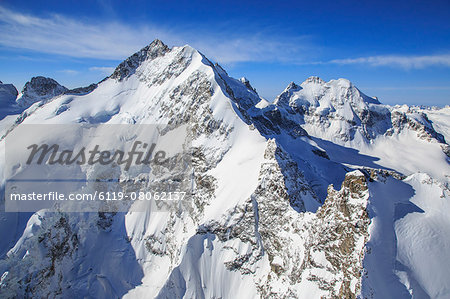 Flying over Piz Bernina and Piz Roseg in winter, Engadine, Switzerland, Europe