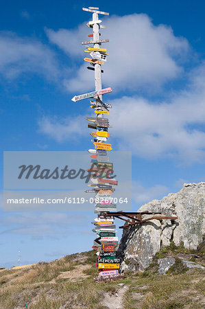 Signs with mileage to world destinations made into a totem pole, Port Stanley, Falkland Islands, South America