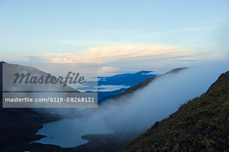 Morning mist over a lake from summit of Cerro Chirripo, 3820m, highest point in Costa Rica, Chirripo National Park, Costa Rica, Central America