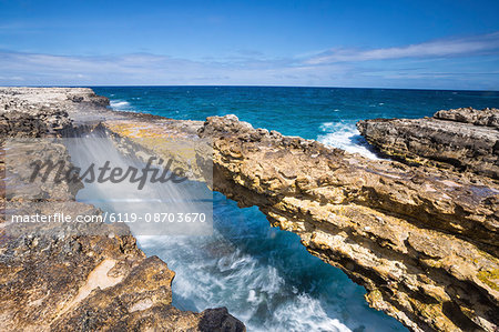 Waves in the natural arches of limestone Devil's Bridge, Antigua, Antigua and Barbuda, Leeward Islands, West Indies, Caribbean, Central America