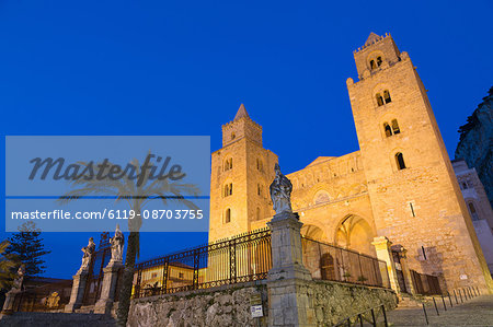 The facade of the Norman Cathedral of Cefalu illuminated at night, Sicily, Italy, Europe