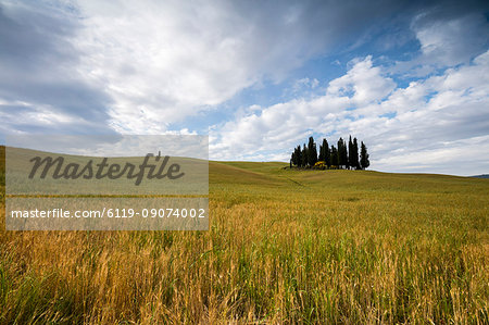 Clouds frame the gentle green hills of Val d'Orcia, UNESCO World Heritage Site, Province of Siena, Tuscany, Italy, Europe