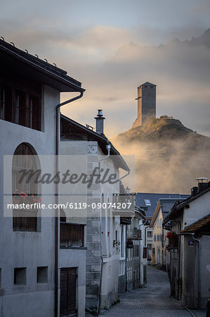 Misty sky on the alpine village of Ardez at sunrise, canton of Graub?nden, district of Inn, lower Engadine, Switzerland, Europe