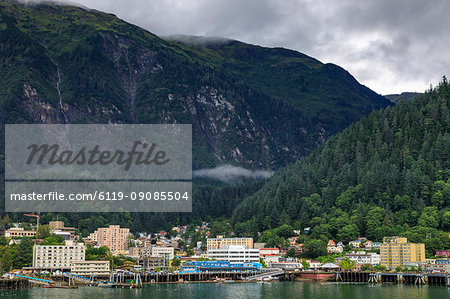 Juneau, State Capital, view from the sea, mist clears over downtown buildings, mountains, forest and float planes, Alaksa, United States of America, North America