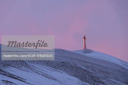 Summit cross of Monte Catria at sunrise in winter, Apennines, Umbria, Italy, Europe