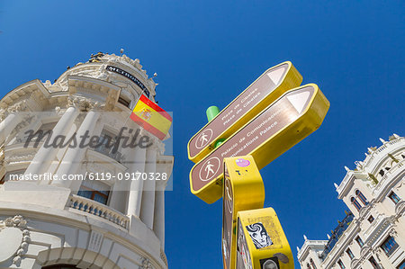 View of sign and Metropolis Building on Gran Via, Madrid, Spain, Europe