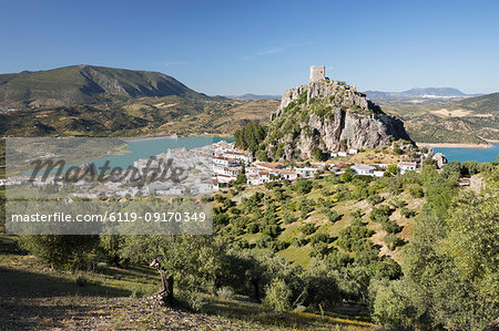 Moorish castle above white village with olive groves, Zahara de la Sierra, Sierra de Grazalema Natural Park, Andalucia, Spain, Europe