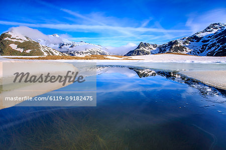 Lake Andossi during spring thaw, Chiavenna Valley, Spluga Valley, Sondrio province, Valtellina, Lombardy, Italy, Europe