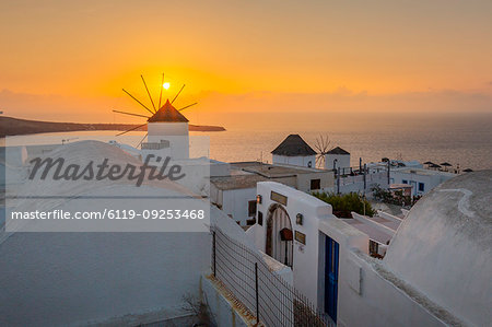 View of windmills at sunset in Oia village, Santorini, Cyclades, Aegean Islands, Greek Islands, Greece, Europe
