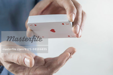 Man's hand holding deck of playing cards, Bavaria, Germany Man's hand holding deck of playing cards, Bavaria, Germany
