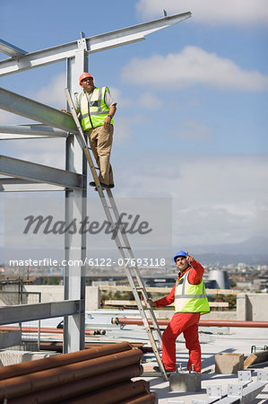 Worker standing on ladder
