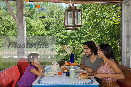 Family having breakfast together outdoors