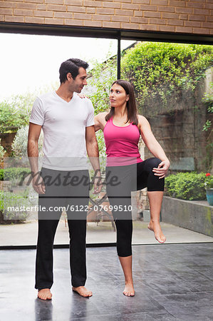 Couple stretching before exercise