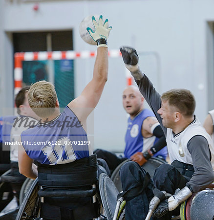 Men in wheelchairs playing pararugby