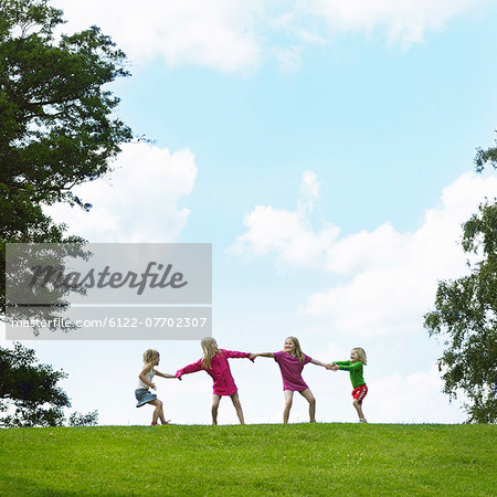 Girls Playing Tug Of War In Field Stock Photo Masterfile Premium Royalty Free Code 6122