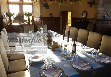 Ornate table settings in dining room