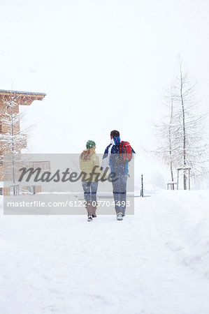 Couple walking together in snow