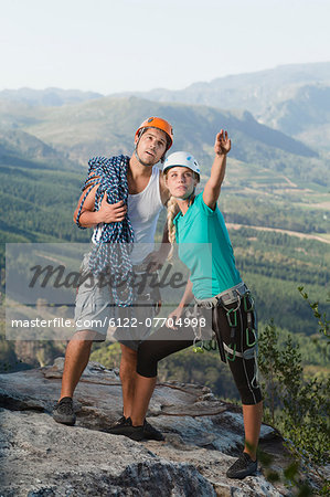 Climbers surveying mountaintop