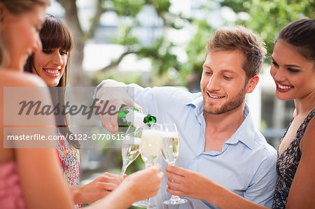 Friends drinking champagne together