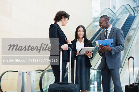 Business people talking in lobby