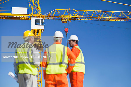 Workers talking at construction site