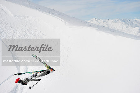 Skier doing flip on snowy slope