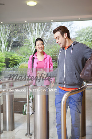 Couple walking through turnstile