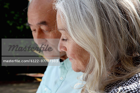 Older couple sitting outside together