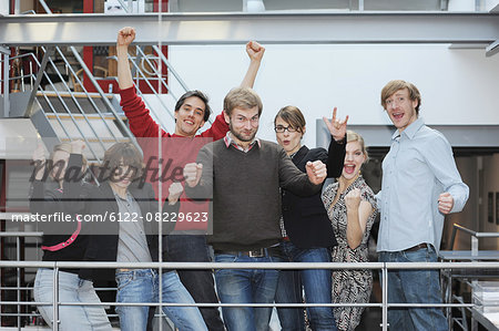 Business people cheering in office