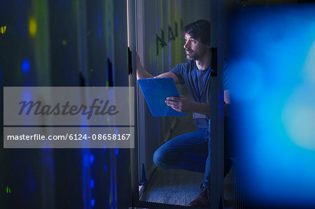 Server room technician with clipboard Server room technician with clipboard