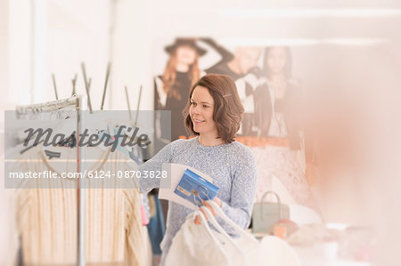 Fashion buyer browsing clothing on rack