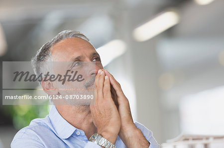 Pensive businessman looking away Pensive businessman looking away