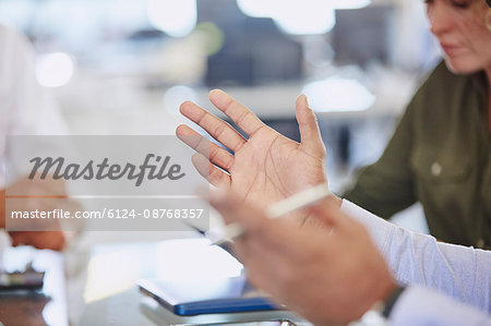 Hands of businessman gesturing in meeting Hands of businessman gesturing in meeting