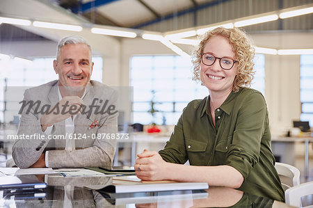 Portrait smiling business people in meeting