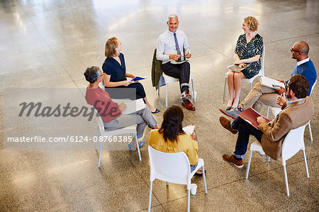 Business people talking in meeting circle Business people talking in meeting circle
