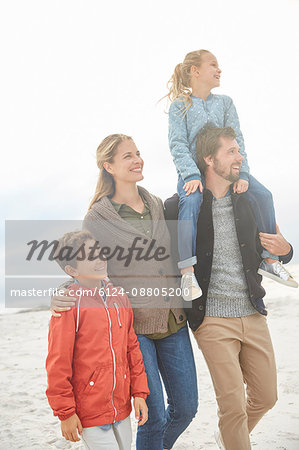 Family walking on winter beach
