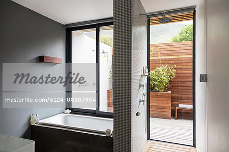 Modern, home showcase interior bathroom with soaking tub and shower