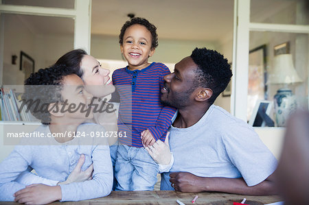 Portrait happy family at table